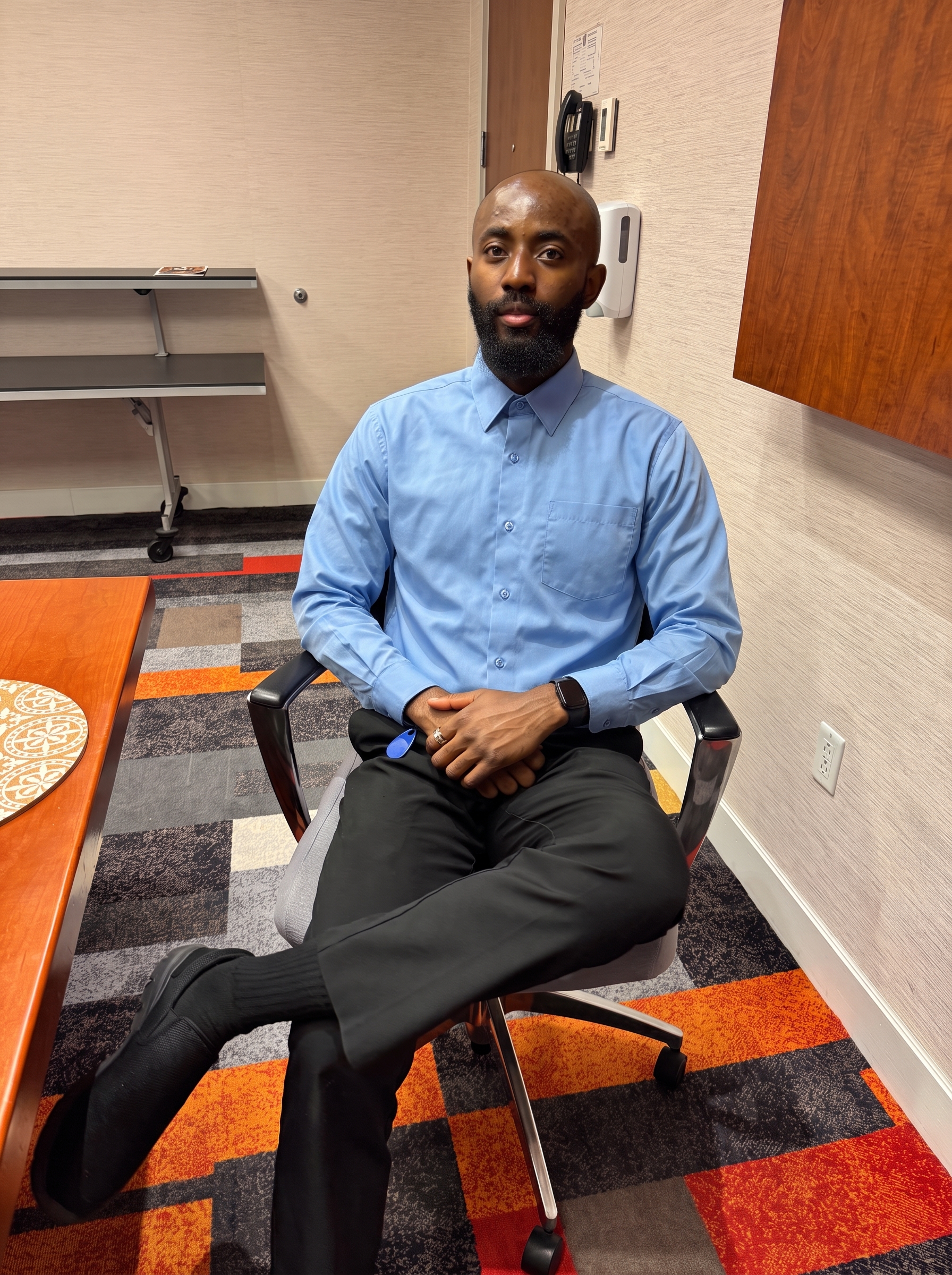 Joshua Abia wearing a blue shirt